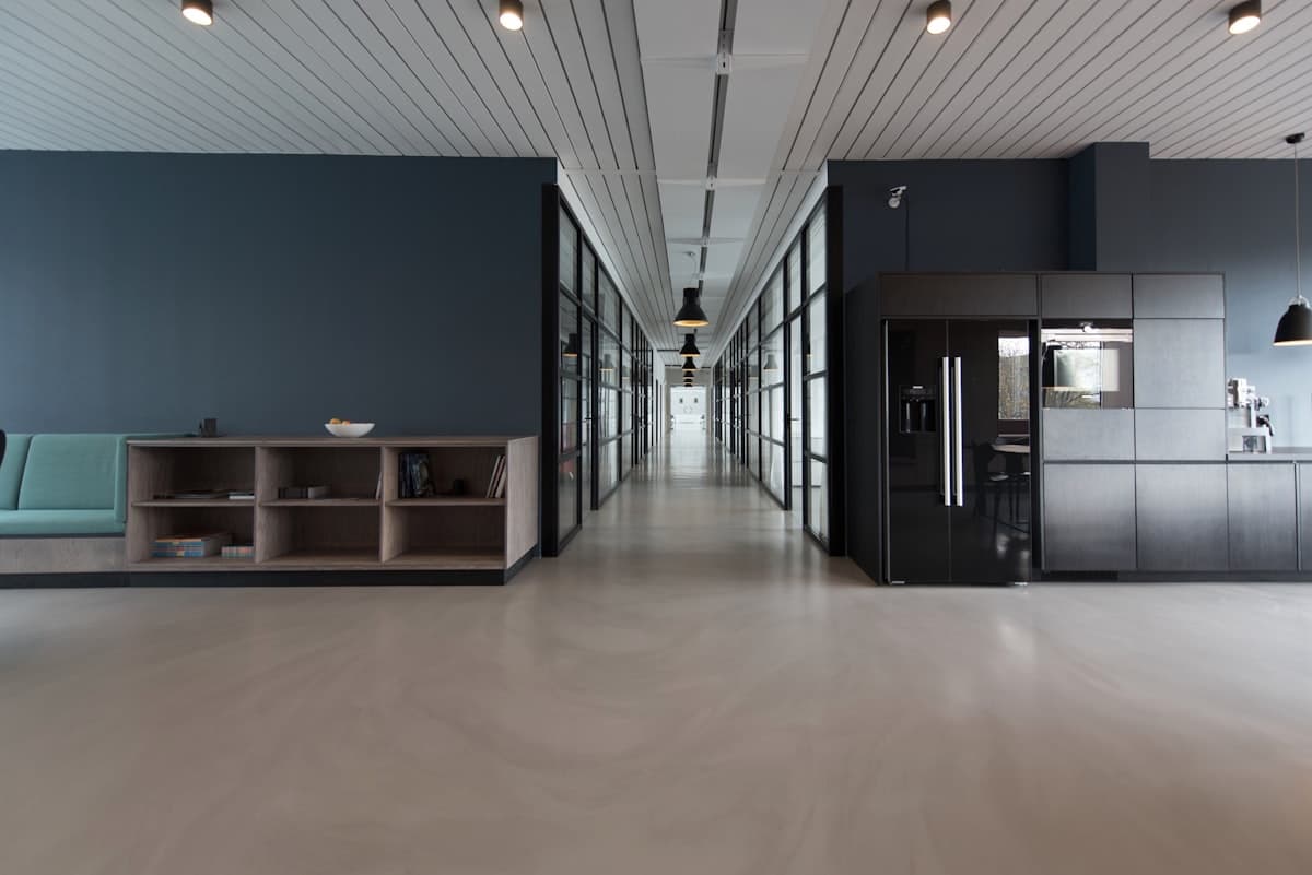 Janitorial professional cleaning a modern office lobby in Savannah GA after business hours